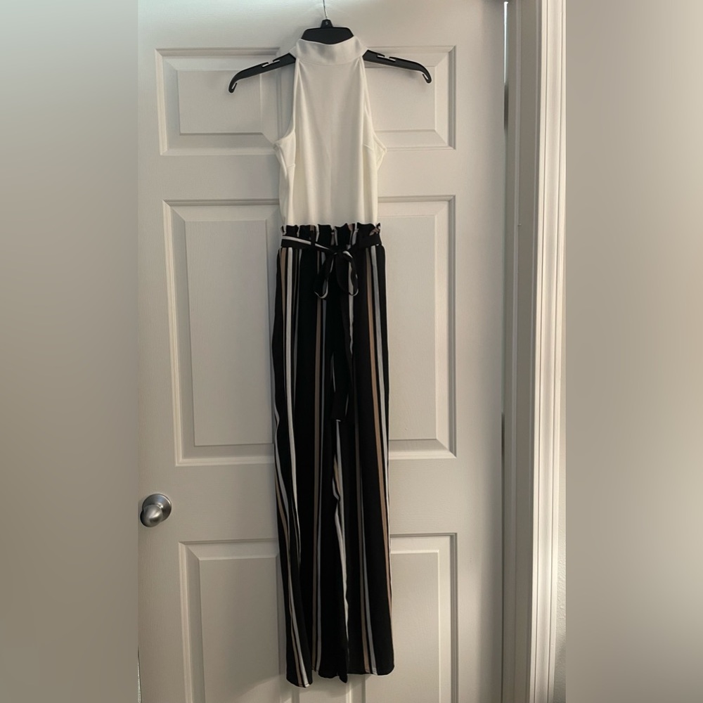 Francesca’s jumpsuit w/ tags on